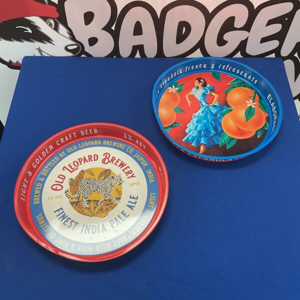 Vintage metal brewery serving tray with colourful design.