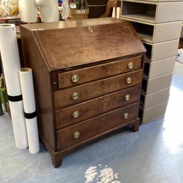 Antique Georgian bureau with four drawers, front view.