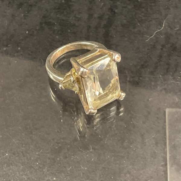 Vintage gold ring with a large cushion cut stone.