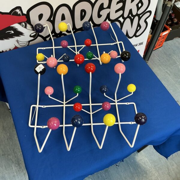 Pair of vintage atomic coat hangers with a retro design.