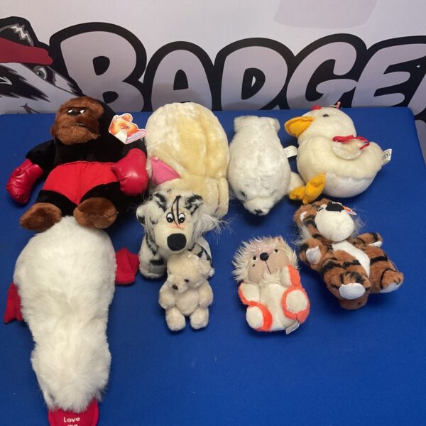 Soft toy collection lot featuring various plush animals.