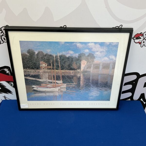 Framed Claude Monet style print of a waterscape with boats.