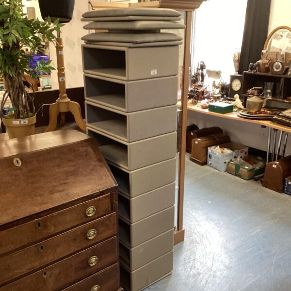 Vintage stackable storage boxes with padded tops, retro storage solution.