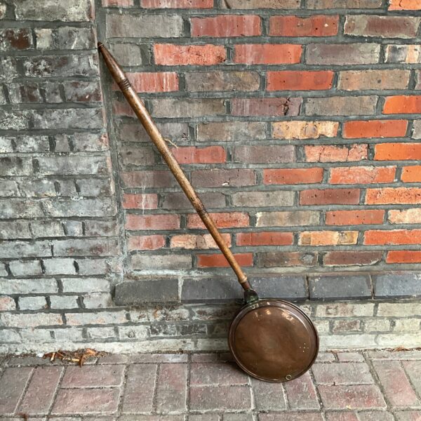 Antique Victorian copper bad pan with embossed paisley design.