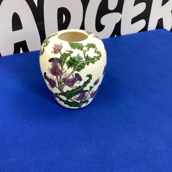 Vibrant hand-painted floral ceramic vase for home decor.