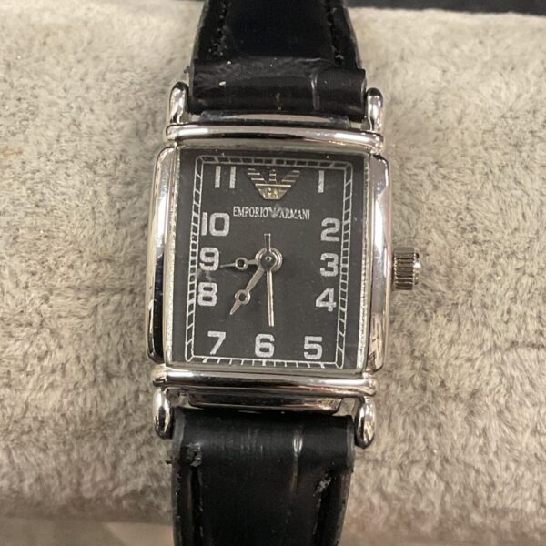 Elegant ladies fashion wristwatch with a round face and bracelet strap.