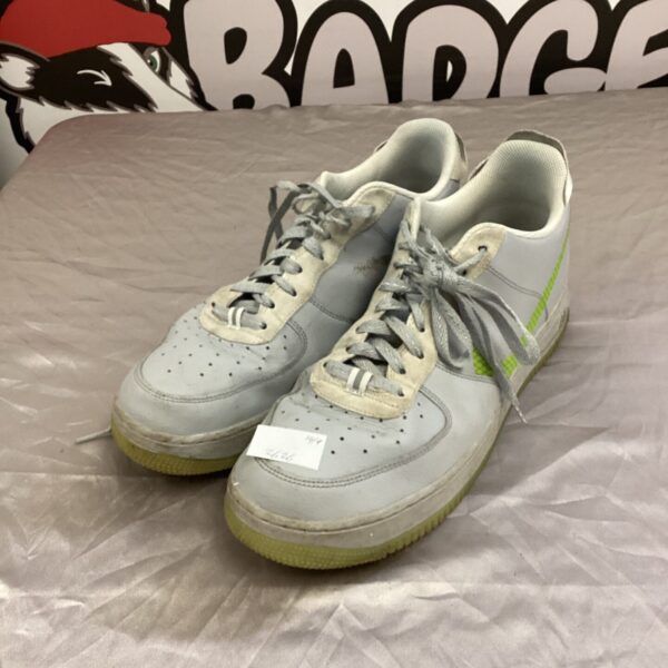 Size 12 Nike Air Force 1 trainers showing wear.
