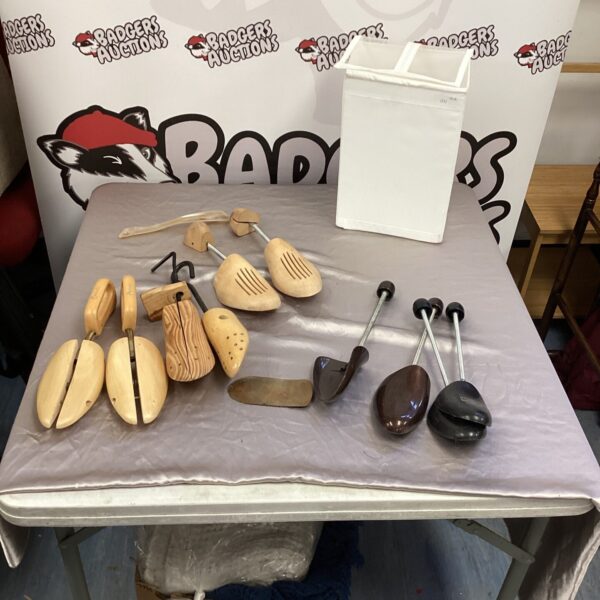 Vintage wooden shoe stretchers including Harrods branded examples.