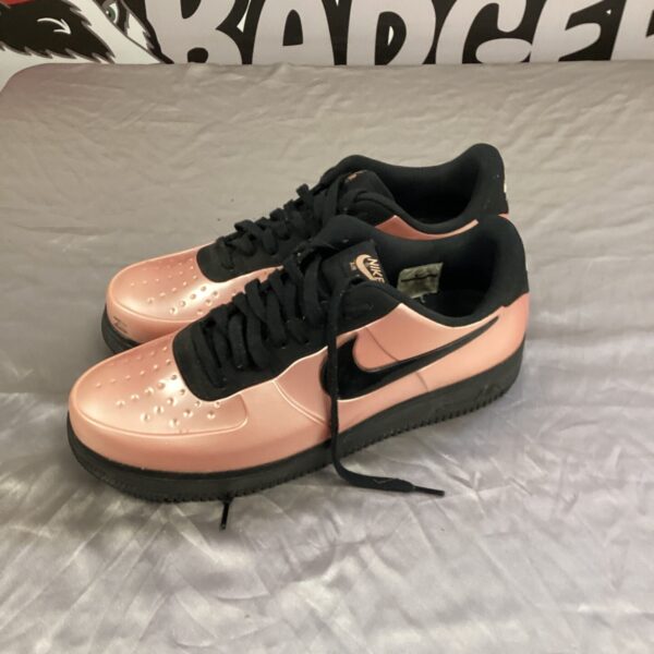 Pink Nike Air Force 1 trainers size 12, stylish athletic shoes.