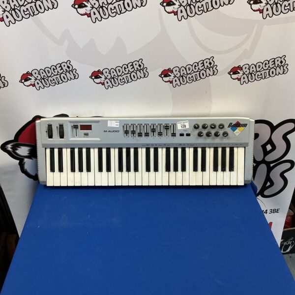 Vintage M-Audio Radium MIDI keyboard controller for music production.