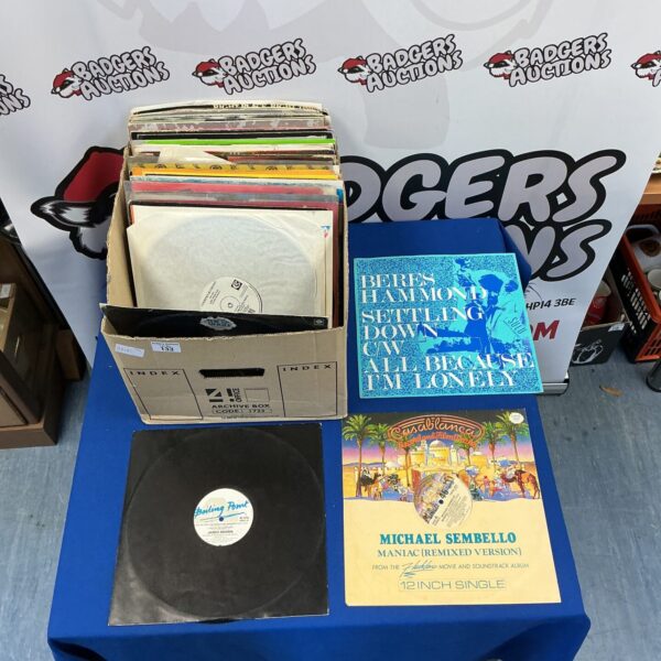 Lot of 12 inch vinyl records including James Brown and Michael Sembello.