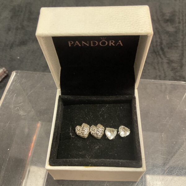 Pandora silver heart and white stone stud earrings pair.