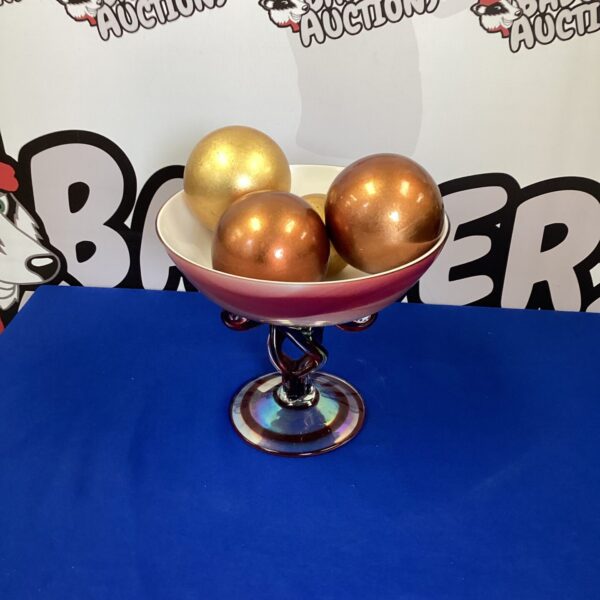 Large glass display bowl filled with colourful glass balls.