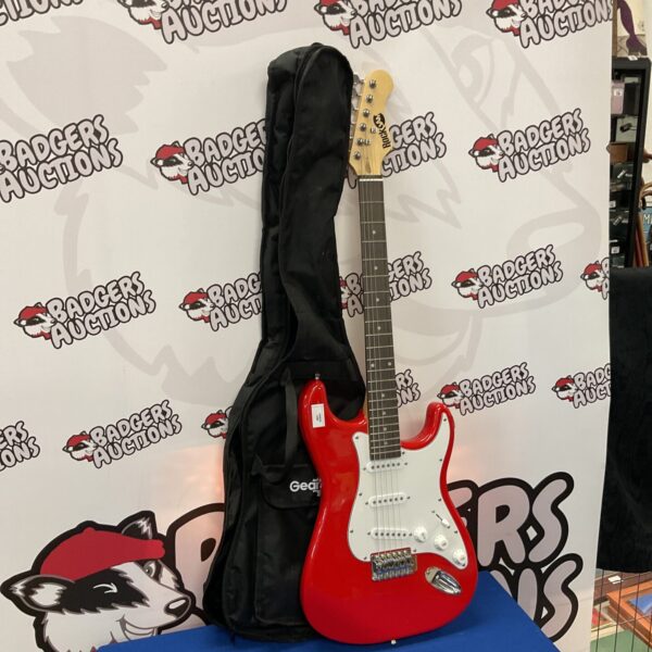 Red electric guitar in black case, musical instrument for rock music.