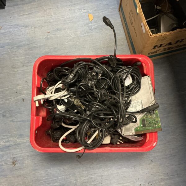 Mixed lot of power cables and electrical leads for various devices.