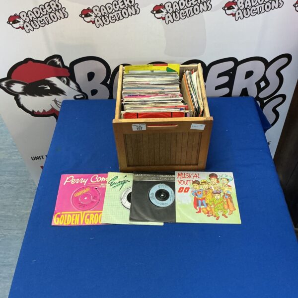Mixed lot of 7 inch vinyl records for collectors and music enthusiasts.
