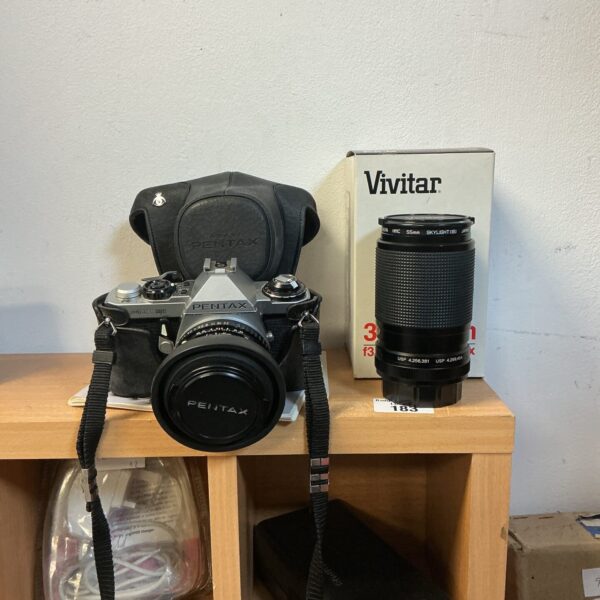 Vintage Pentax ME Super camera with Vivitar zoom lens.