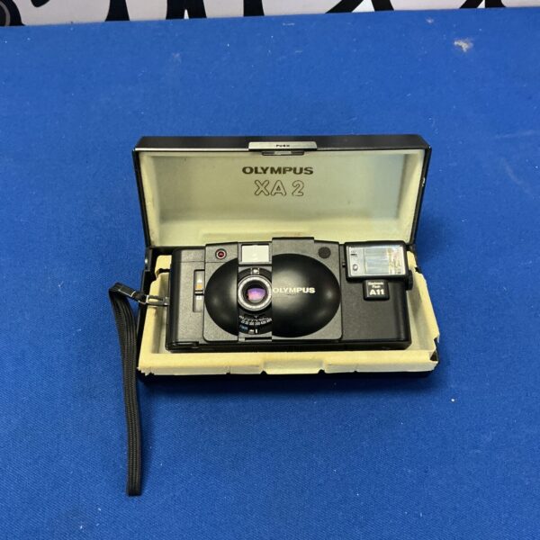 Vintage Olympus XA2 camera, a compact 35mm film camera.