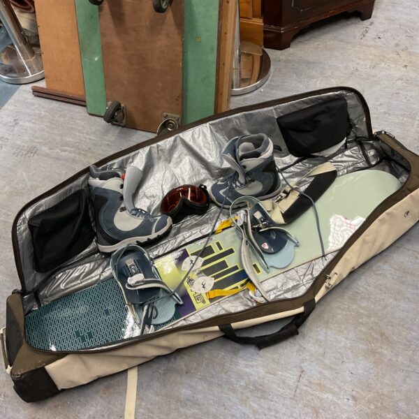 Burton snowboard bundle with boots and bindings in carry bag.