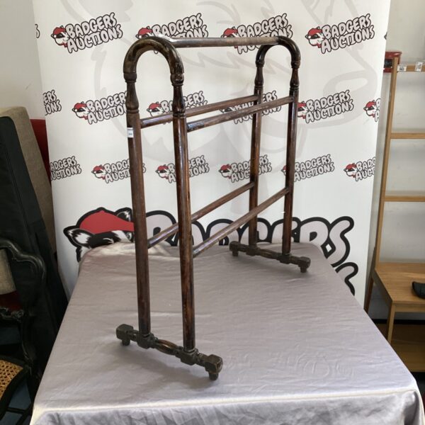 Vintage wooden clothes horse for drying laundry indoors.