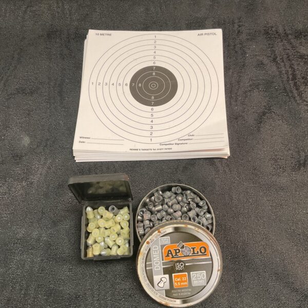 Lot of .22 airgun pellets and target sheets for shooting practice.