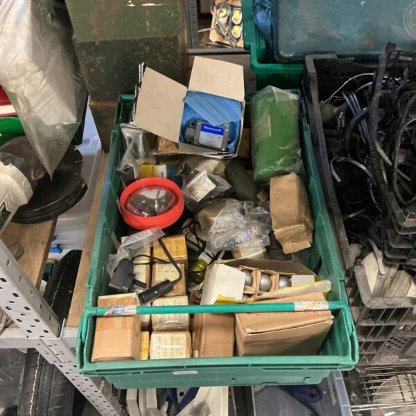 Military vehicle spare parts lot with lights and switch.