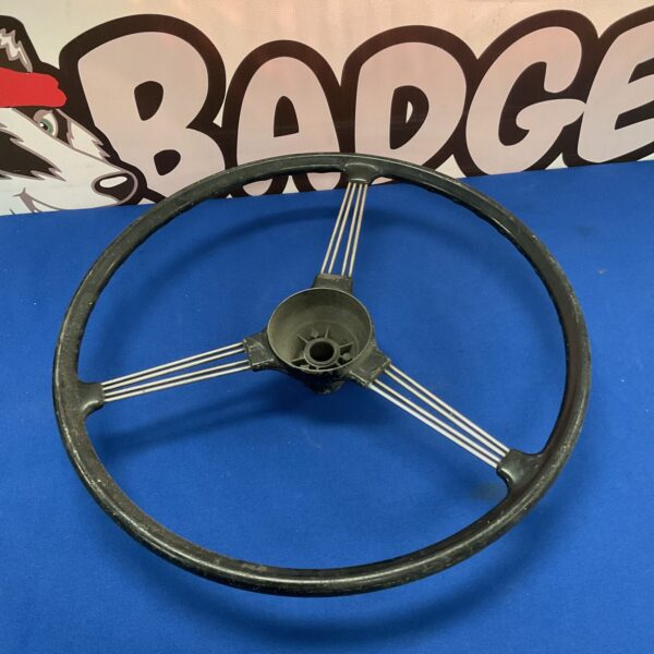 Vintage Riley steering wheel for classic car restoration.