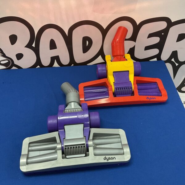 Pair of Dyson vacuum cleaner heads for floor cleaning.