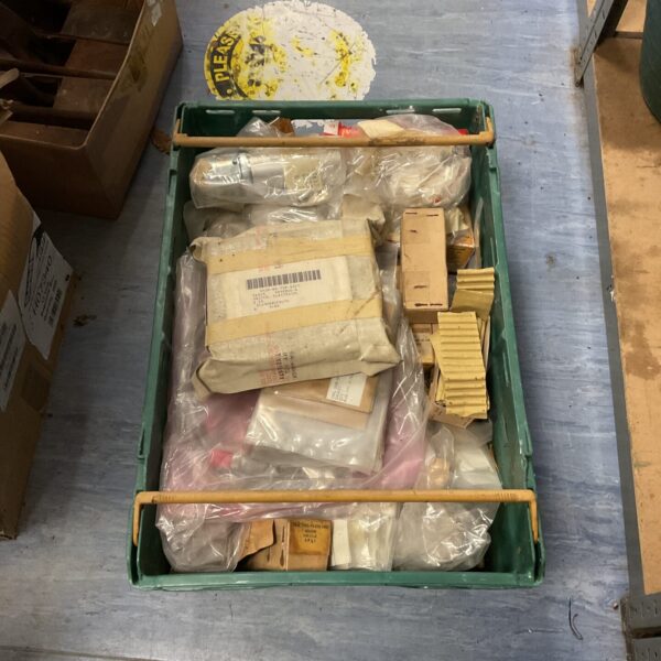 Tray of vintage military spare parts and components.