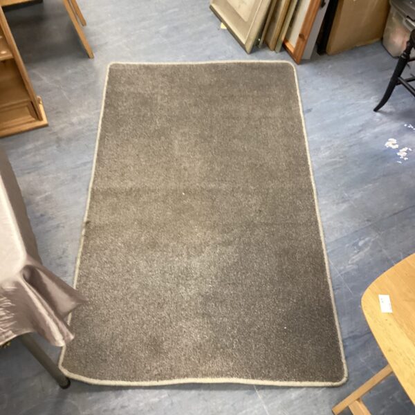 Neutral grey floor rug for living room comfort.