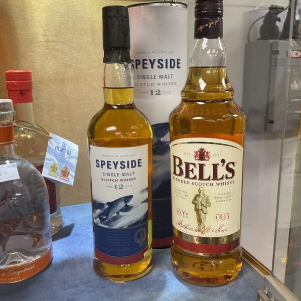 Speyside Single Malt and Bells Blended Scotch whiskey bottles.