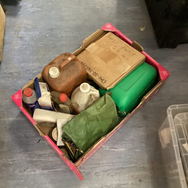 Mixed chemicals and a Halfords fuel can in a tray.