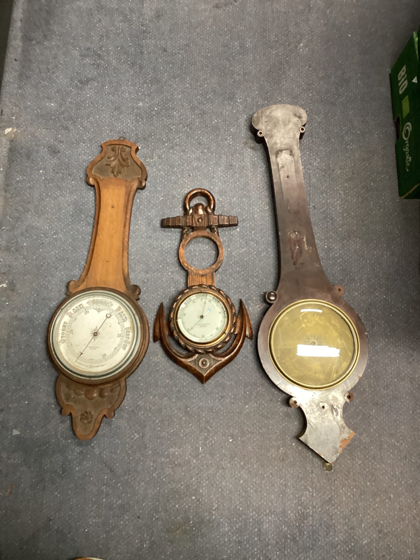 1158 Three antique oak cased barometers