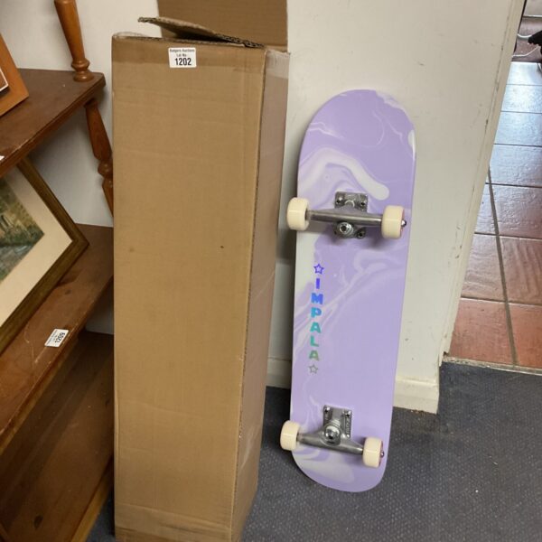New Impala Cosmos skateboard in original packaging.