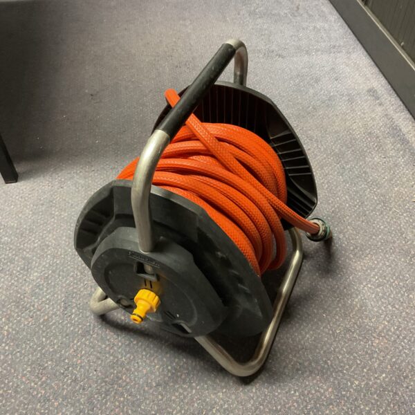 Used Karcher hose reel for convenient garden hose storage.