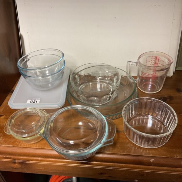 Vintage Pyrex glass bowls and jug collection on display.