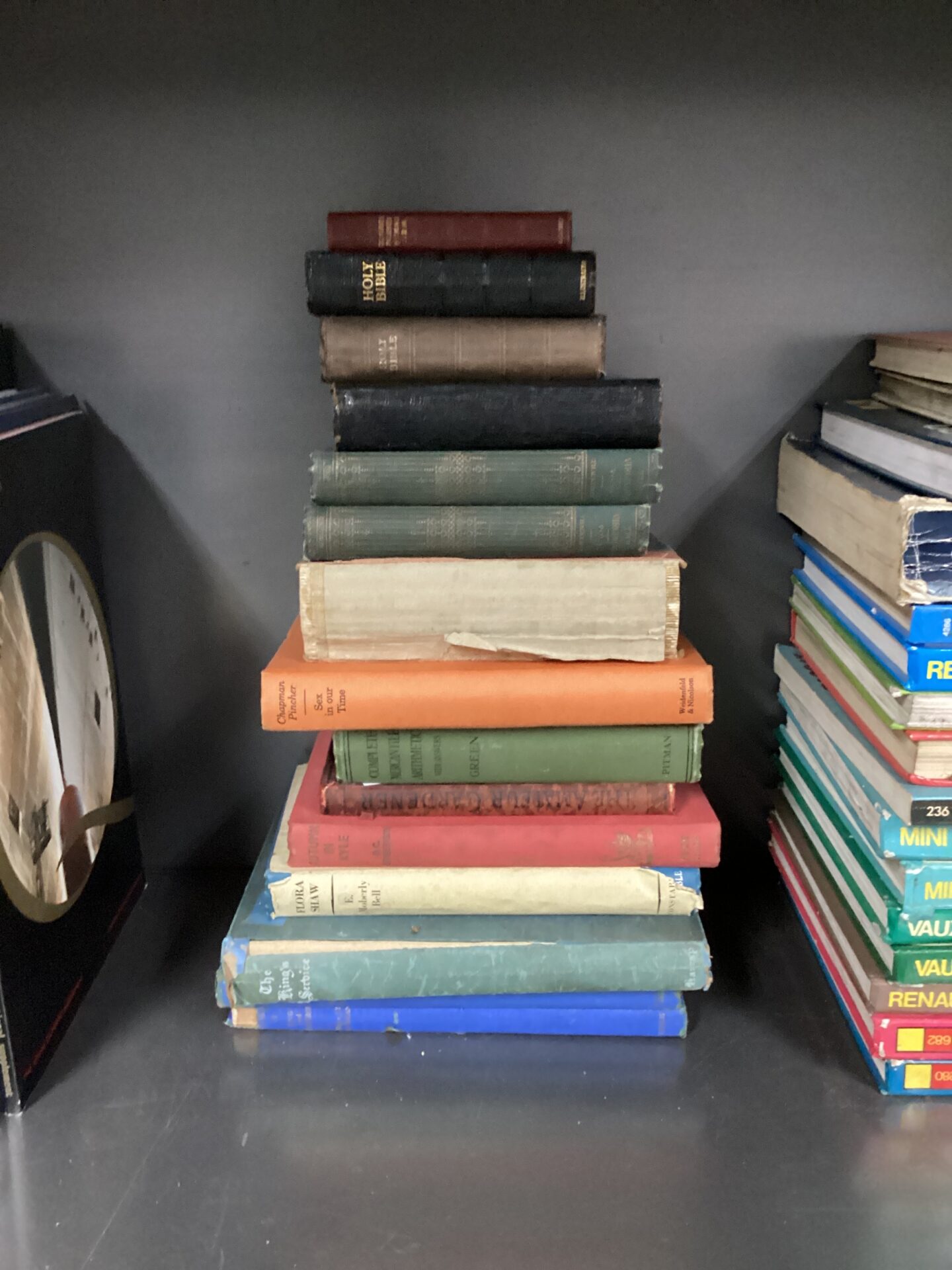 1168 Selection of antique & vintage books inc three holy bibles, chapman pintcher & flora shaw