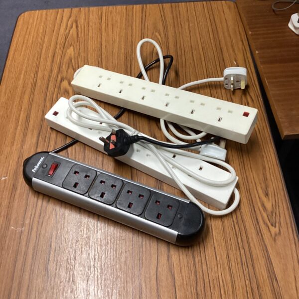 Three extension leads, including a Fellowes brand, for multiple socket power.