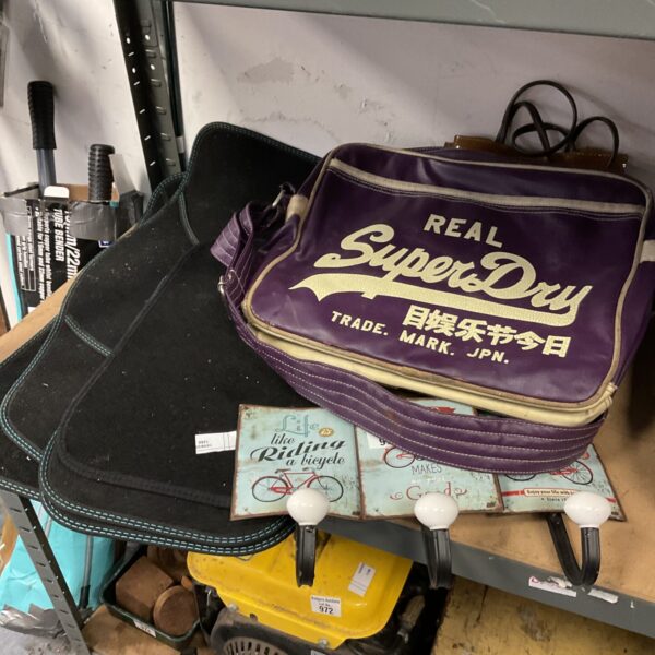 Superdry shoulder bag with car mats and tin coat hooks.