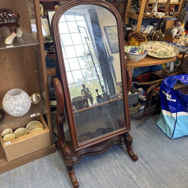 Large antique mahogany cheval mirror with carved frame.