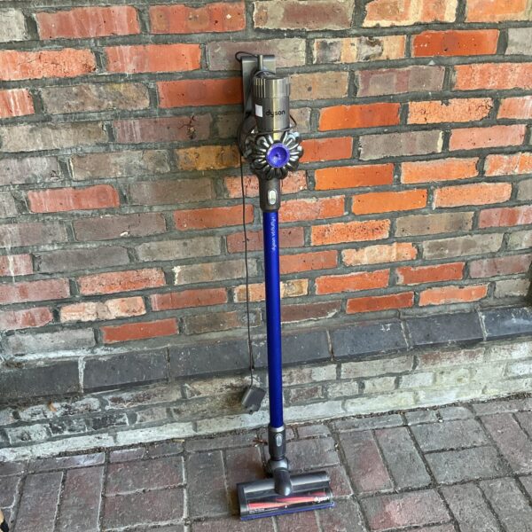 Dyson V6 Fluffy cordless vacuum cleaner in silver and blue.