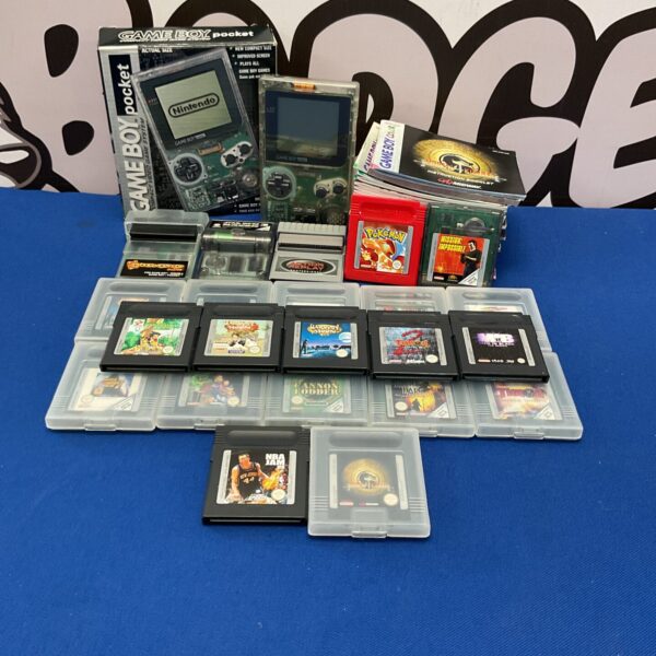 Boxed Nintendo Game Boy Pocket with games and manuals, retro gaming console.