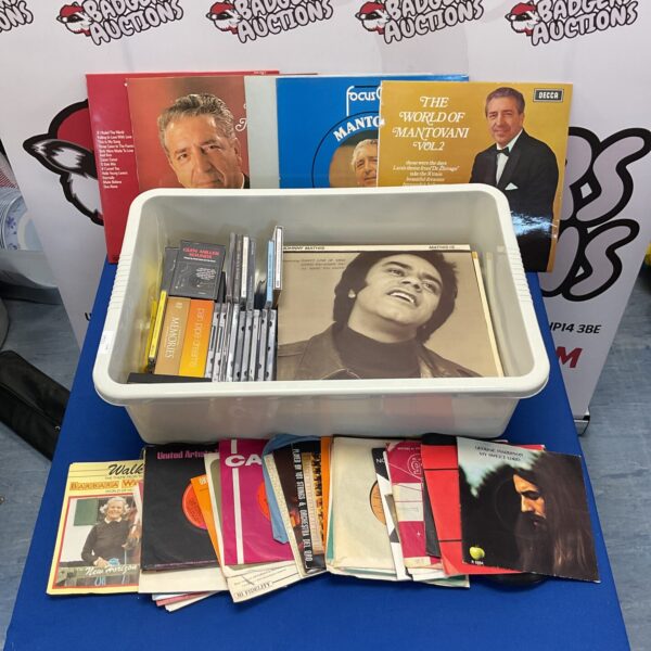 Assorted vinyl records including George Harrison and Mantovani.