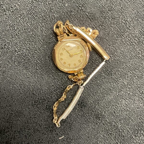 Vintage 9ct gold pin watch with delicate chain.