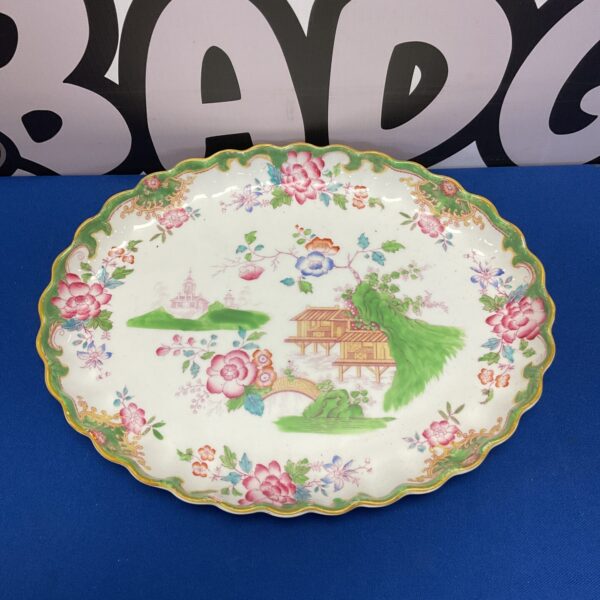 Antique Royal Doulton pagoda serving plate with floral details.