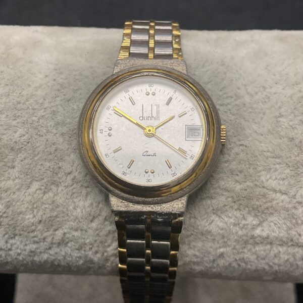 Vintage Alfred Dunhill quartz watch with gold bezel.