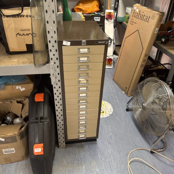 Beige metal Beam filing cabinet with labelled drawers.
