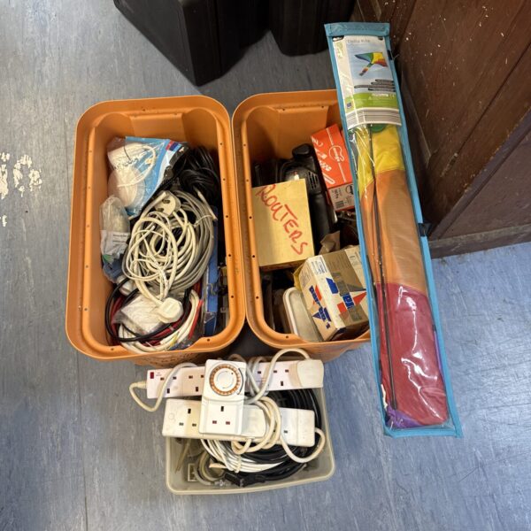 Garage clearance lot with three boxes of tools and cables.