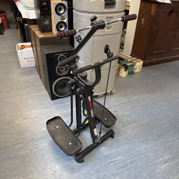 Front view of a compact mini exercise machine for home use.