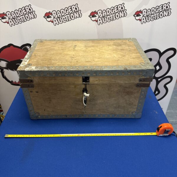Vintage wooden carpenter's tool box with galvanized edges.